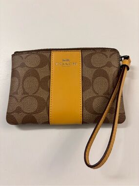 Coach Brown Signature Canvas Wristlet with Yellow Center Stripe